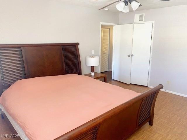 bedroom featuring visible vents and baseboards