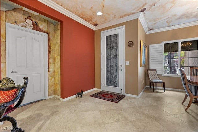 foyer entrance featuring baseboards and ornamental molding