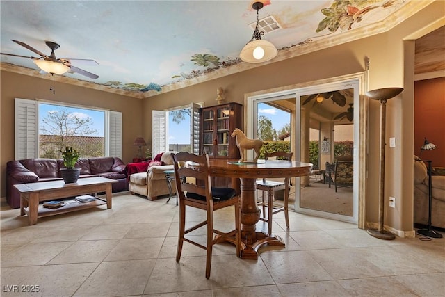 dining room featuring light tile patterned floors, visible vents, and ceiling fan