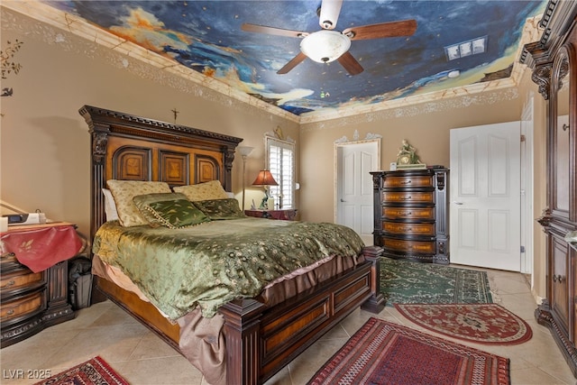 bedroom with light tile patterned floors, a ceiling fan, and ornamental molding