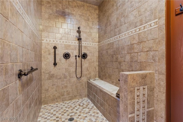 bathroom featuring a tile shower