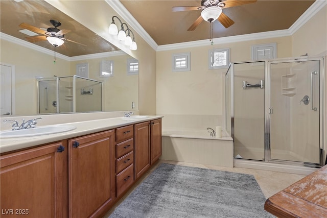 full bath with a ceiling fan, a stall shower, ornamental molding, tile patterned flooring, and a sink