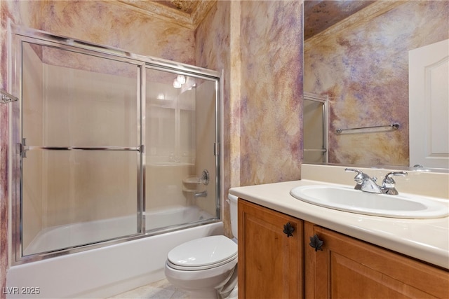 full bath featuring combined bath / shower with glass door, toilet, and vanity