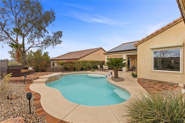 view of pool featuring a patio area, a fenced in pool, and a fenced backyard