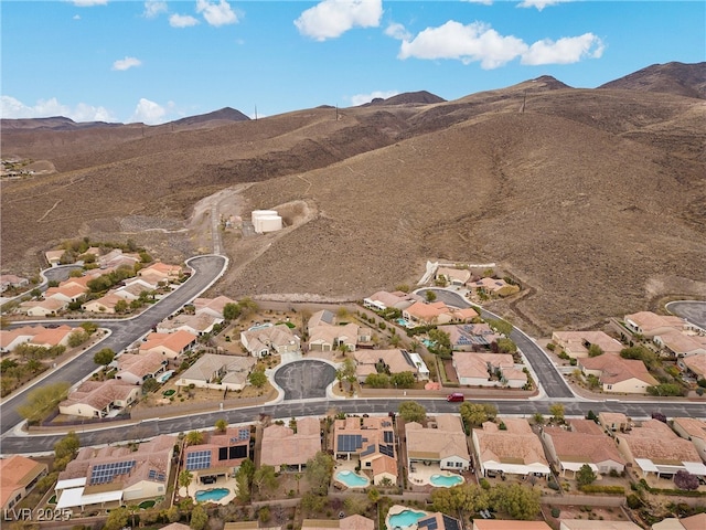 birds eye view of property with a mountain view and a residential view