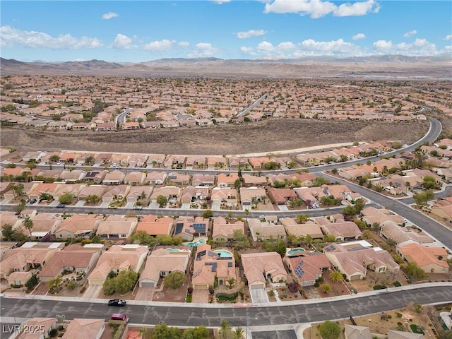 drone / aerial view featuring a residential view and a mountain view