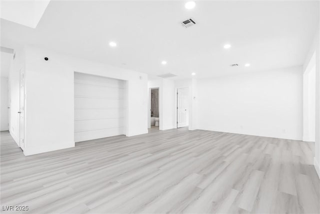 unfurnished room with recessed lighting, visible vents, and light wood finished floors