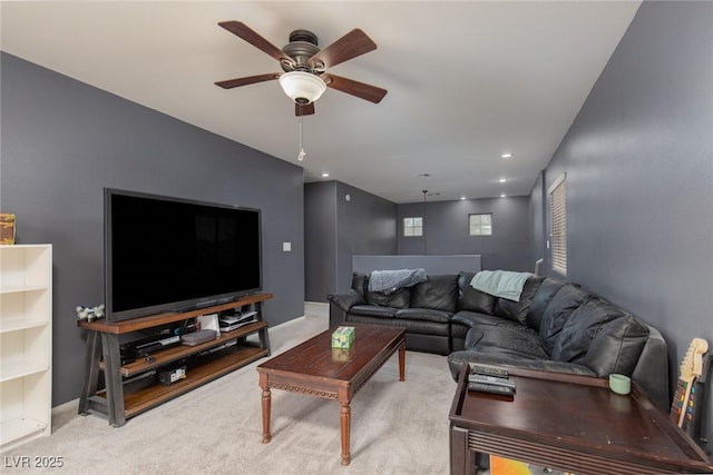 living room featuring recessed lighting, light colored carpet, baseboards, and ceiling fan