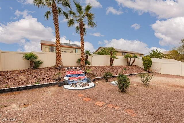 view of yard with a fenced backyard