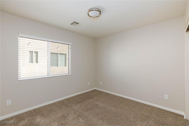 carpeted empty room with baseboards and visible vents