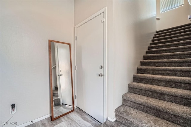 stairs with wood finished floors