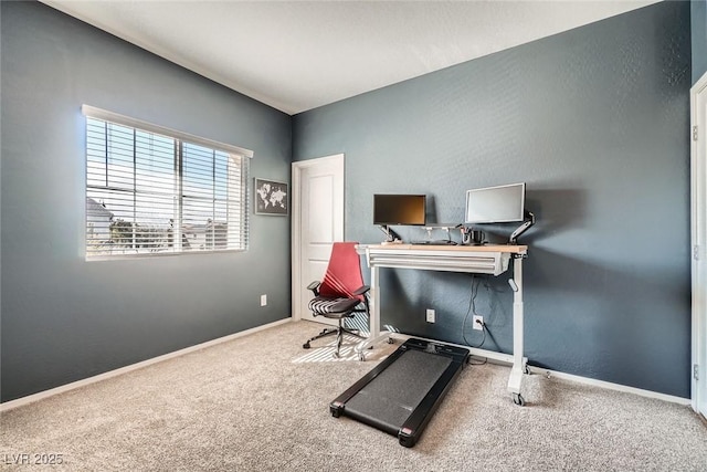 carpeted home office featuring baseboards