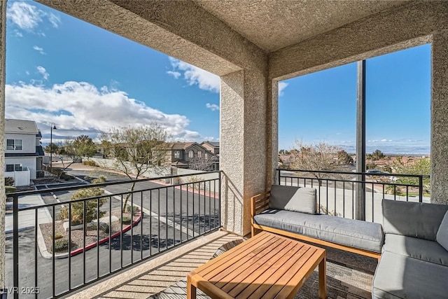 balcony featuring a residential view and an outdoor hangout area