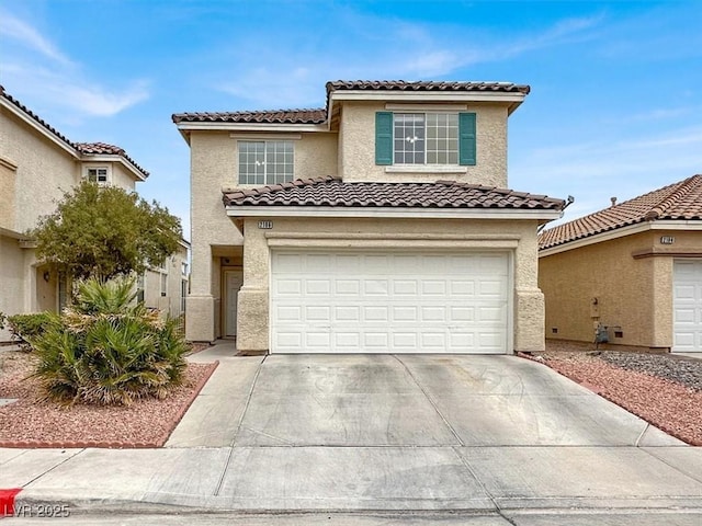 view of front of property with a tile roof, concrete driveway, a garage, and stucco siding