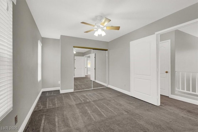 unfurnished bedroom with a closet, baseboards, ceiling fan, and carpet flooring