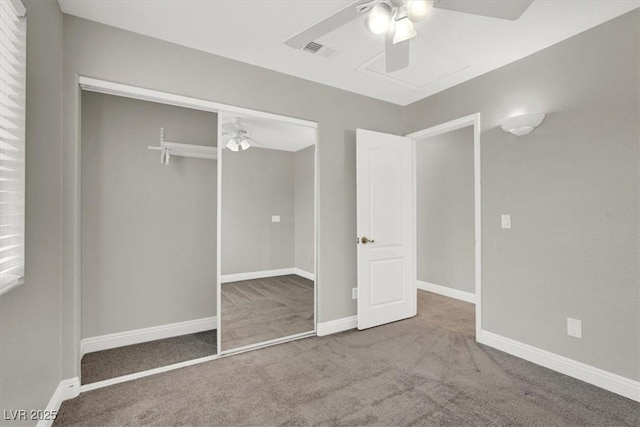 unfurnished bedroom with baseboards, carpet floors, a closet, and a ceiling fan