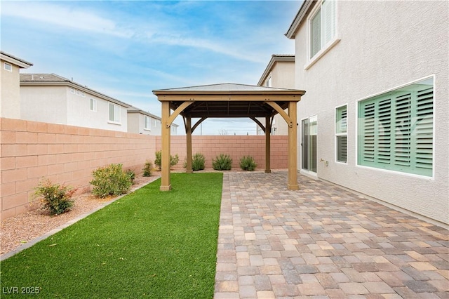5384 Knitmore Ct, Las Vegas, NV 89139 - fenced backyard featuring a gazebo and a patio area