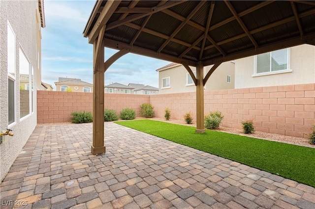 view of patio / terrace featuring a gazebo and a fenced backyard