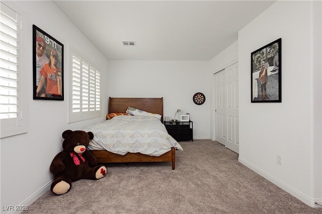 bedroom with carpet flooring, baseboards, and visible vents