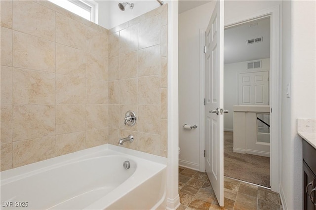 bathroom with visible vents, toilet, vanity, and  shower combination