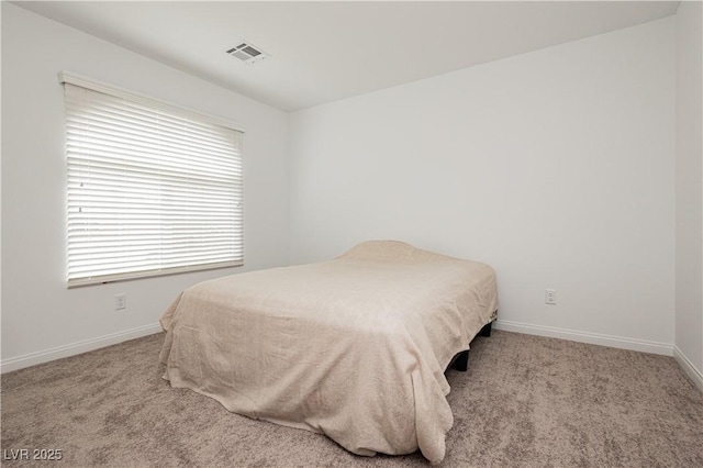 bedroom featuring carpet flooring, baseboards, and visible vents