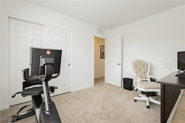 office area featuring visible vents, baseboards, and carpet flooring