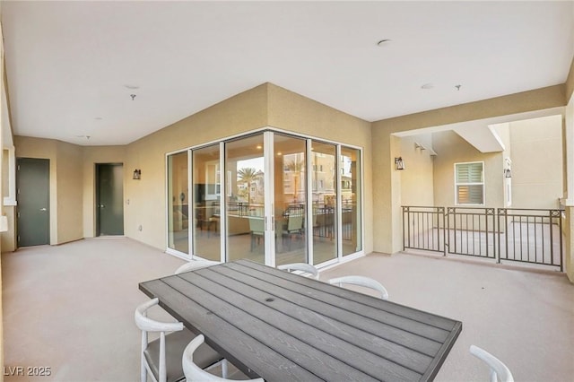 view of patio featuring outdoor dining area