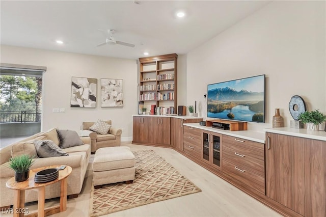 living room featuring recessed lighting, light wood-style floors, and ceiling fan