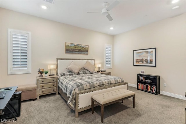 bedroom featuring recessed lighting, light colored carpet, baseboards, and ceiling fan