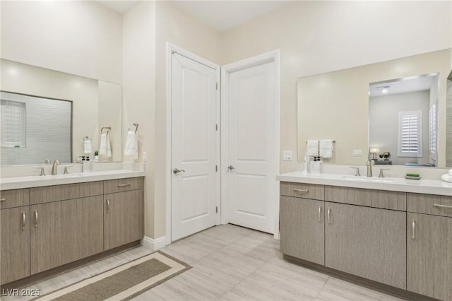 bathroom with a sink and two vanities