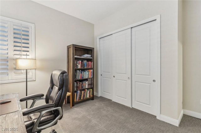 carpeted office with baseboards