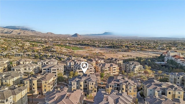 birds eye view of property featuring a mountain view and a residential view