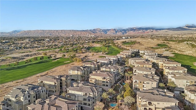 bird's eye view featuring view of golf course, a mountain view, and a residential view