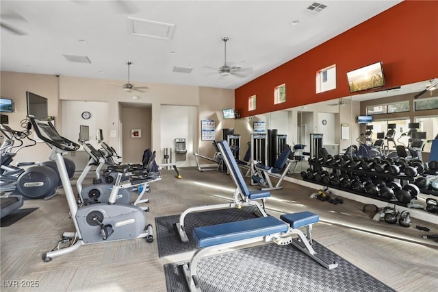 gym featuring a ceiling fan and visible vents