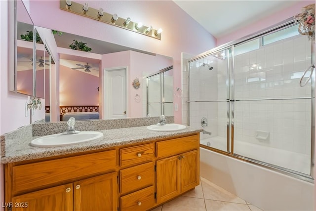 ensuite bathroom featuring tile patterned floors, double vanity, ensuite bathroom, and a sink