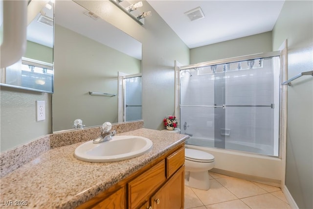 full bathroom featuring tile patterned floors, visible vents, toilet, and vanity