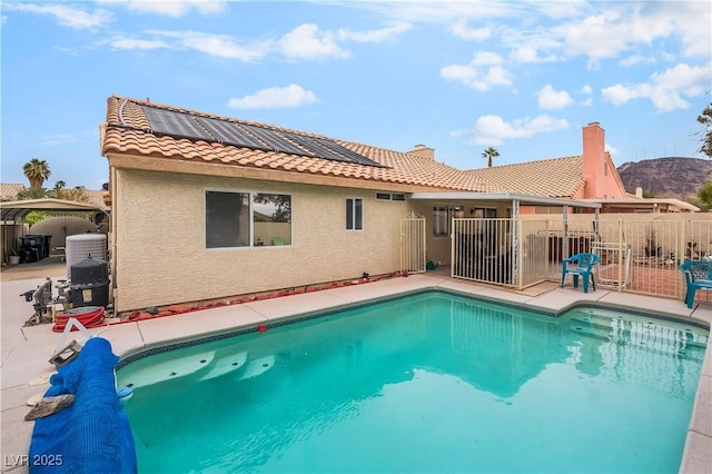 view of pool with a patio area, fence, and a fenced in pool