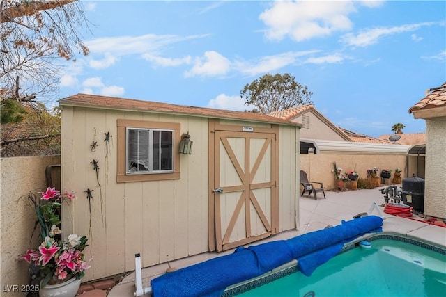 view of shed with fence