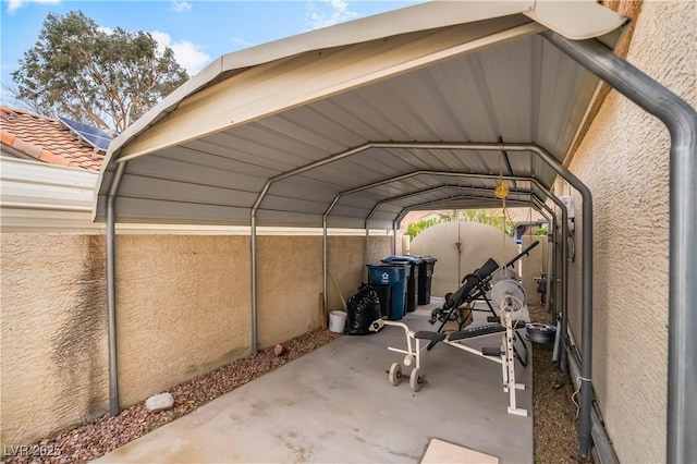 view of vehicle parking with a carport