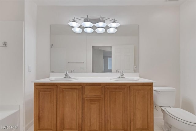 full bathroom with a sink, a washtub, toilet, and double vanity