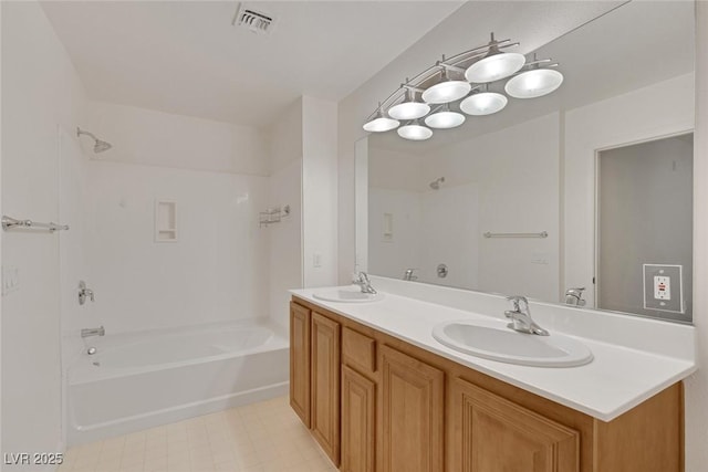 full bath with shower / bathing tub combination, double vanity, visible vents, and a sink