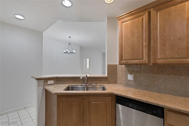 kitchen featuring a notable chandelier, a sink, backsplash, stainless steel dishwasher, and light tile patterned floors