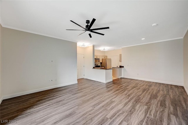 unfurnished living room with ornamental molding, wood finished floors, and ceiling fan