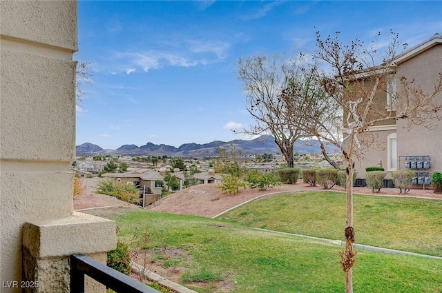 view of yard featuring a mountain view and a residential view