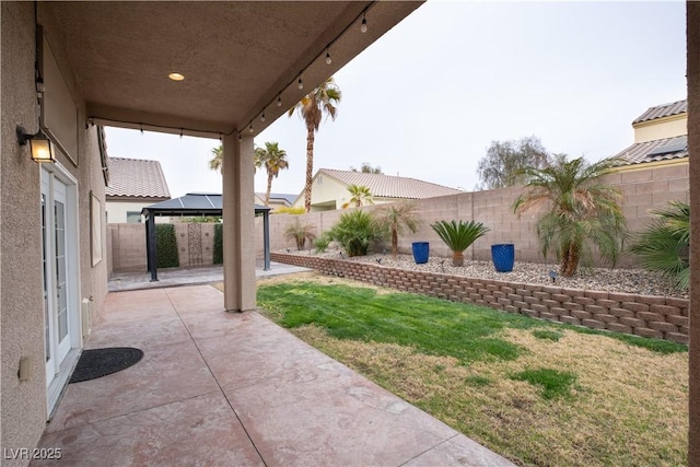 view of patio / terrace featuring a gazebo and a fenced backyard