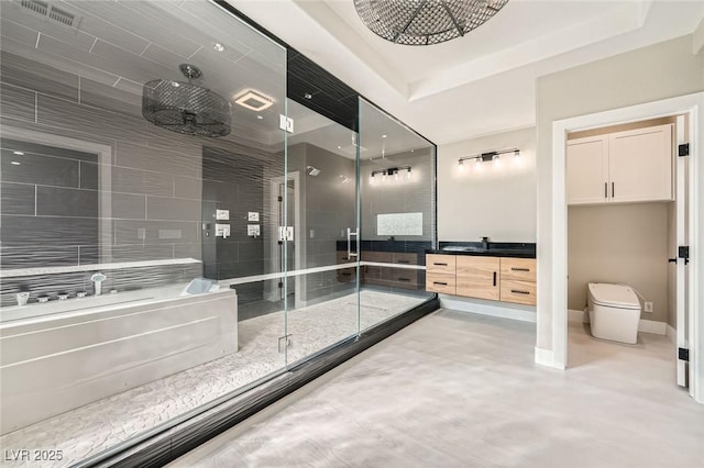 full bathroom featuring finished concrete floors, a shower stall, vanity, and baseboards