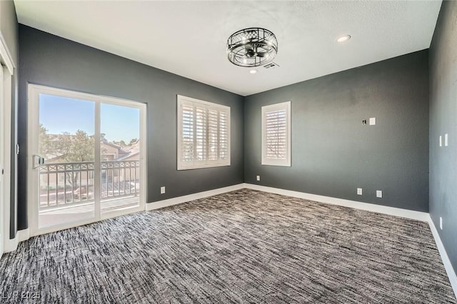 carpeted spare room featuring visible vents, recessed lighting, and baseboards