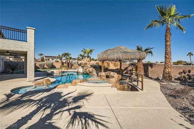 view of pool featuring a fenced in pool, a patio, an in ground hot tub, and a fenced backyard