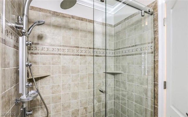 full bathroom with tiled shower and crown molding