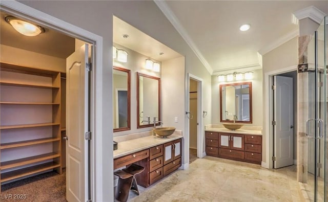 full bath featuring vanity, baseboards, a stall shower, and ornamental molding